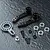 MST aluminium steering arm set including black steering arms, a silver servo horn, screws, washers, and ball bearings on a dark textured surface.