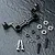 MST black aluminium steering joint plate with included bearings, screws, and spacers on a dark textured surface.