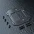 MST carbon fibre battery mount plate with four screws and two cylindrical metal posts on a dark textured background.