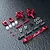 A set of red anodized aluminium RC rear hubs and associated hardware including turnbuckles, ball ends, and spacers on a dark textured surface.