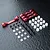 MST red aluminium suspension arm mount set including four metal mounts, screws, plastic spacers, and bushings on a dark textured surface.