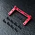 A red anodized aluminium servo mount for RC cars, accompanied by eight black screws and four small black washers on a dark textured surface.