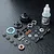 An MST 60T limited slip differential kit including gears, housing, bearings, screws, shims, and a bottle of 3000# gear diff oil on a black surface.