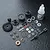 MST Limited Slip Differential gear set components including gears, bearings, shims, screws, and a bottle of 3000# gear diff oil on a black textured surface.