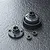 MST bevel gear differential set components including a large gear housing, a circular cover plate, and two small ball bearings on a dark textured surface.