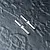 Two silver metal drive pins with a flat notch in the center, positioned diagonally on a dark textured surface.