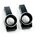 Two black anodized aluminium RC rear hubs with silver chamfered edges on a white background.