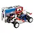 Team Associated RC10 4WD Factory Team 1/10 scale electric buggy kit in front of its colourful product packaging box.