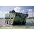Box art illustration of the Academy 1/35 R.O.K. Army K808 Wheeled Armored Vehicle model kit driving on a road.