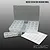 CowRC micro screw storage box with multiple small compartments and a sheet of blank label stickers against a gradient background.
