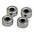 Four small metal shielded ball bearings arranged on a plain white background.