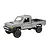 Studio product shot of a silver MN Model Toyota LC79 Pro RC rock crawler electric truck on a white background.