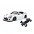 MST 86RB white RC drift car body with wide body kit alongside its black chassis on a white background