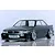 Dark green metallic RC drift car body shell mounted on a chassis with custom wheels and intercooler visible.