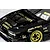 Close-up of a black RC drift car body with gold decals, custom vented hood, and gold rims on a light surface.