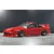 Painted red Pandora RC Nissan 180SX Kouki body shell mounted on an RC drift car chassis against a dark background.