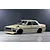 Pandora RC Toyota Corolla KE70 RC drift car body shell painted beige with black wheels on a studio floor.