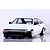 Studio product shot of a white Toyota AE86 Corolla Levin RC car body with black bumpers and custom wheels against a white brick wall background.
