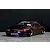 A Pandora RC BNR32 Skyline GT-R drift body shell in metallic purple, displayed on a studio floor with low-slung wheels and custom decals.