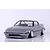 Grey Mazda Savanna RX-7 SA22C drift RC car body shell with aftermarket deep dish wheels in a studio setting.