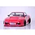 Front view of a red RC drift car body shell on a white studio surface with a visible intercooler and black wheels.