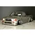 Pandora RC Toyota Hilux RN80 RC drift body shell painted metallic grey with wide fenders and custom wheels on a marble surface.