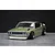 Front three-quarter view of a gold Pandora RC KPGC110 Skyline 2000GT-R drift car body shell on a grey surface.