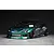 Custom painted green metallic RC drift car body shell mounted on a chassis with deep dish wheels against a dark background.