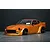Orange Pandora RC S30 Fairlady Z Star Road drift body shell mounted on a chassis with deep-dish wheels against a dark background.