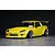 Custom painted yellow Honda S2000 RC drift car body shell with aftermarket aero kit, wide fenders, and black wheels against a dark background.