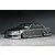 Studio photo of a grey Toyota Mark 2 JZX110 BN-Sports RC drift car body shell mounted on a chassis with chrome deep dish wheels.