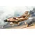Completed Italeri 1/32 scale Tornado GR.1 military jet model in desert camo flying over a smoky battlefield diorama background.