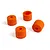 Four small orange cylindrical wheel washers or spacers arranged on a plain white background.