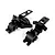 Two black molded plastic upper chassis and gearbox cover parts for a 1/18 RC vehicle set on a white background.