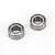 Two metal shielded ball bearings shown on a plain white background in a studio setting.