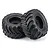 Two black RC monster truck tyres mounted on black rims against a clean white studio background.