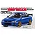 Product packaging artwork showing a blue Subaru Impreza WRX STi Version VI model car with gold wheels and a large rear wing.