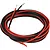 Coiled red and black silicone wire featuring exposed stripped copper ends against a plain white background.