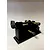 TK Racing tyre prep and break in machine featuring black and brass components against a white background.
