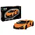 Revell 1/24 scale Lamborghini Revuelto model car kit next to its assembled orange car model on a white background.