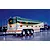 Illustration of a BP heavy fuel tank trailer parked on a wet road at night with a refinery in the background.