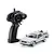 Kyosho First Mini-Z Back to the Future DeLorean RC car with its black pistol grip transmitter against a white background.