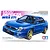 Tamiya 1/24 scale Subaru Impreza WRX STi plastic model kit box art featuring a blue sedan with gold wheels.