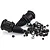 A collection of Rovan 5IVE-T RC spare parts including two black rubber drive shaft boots, various black metal nuts, grub screws, and body clips.