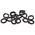 A pile of fifteen black metal split spring washers for RC cars on a white background.