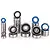 A collection of various sized metal ball bearings with blue and black rubber seals arranged in stacks on a white background.