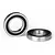 Two rubber-shielded ball bearings for RC vehicles, one standing upright and one lying flat on a white background.