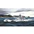 An artistic illustration of the German heavy cruiser Prinz Eugen sailing through choppy seas with a mountainous coastline in the background.