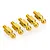 Five gold-coloured metal 5mm pivot balls for RC cars arranged in a diagonal line on a white background.