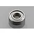 A single metal shielded ceramic ball bearing for RC vehicles against a grey background.